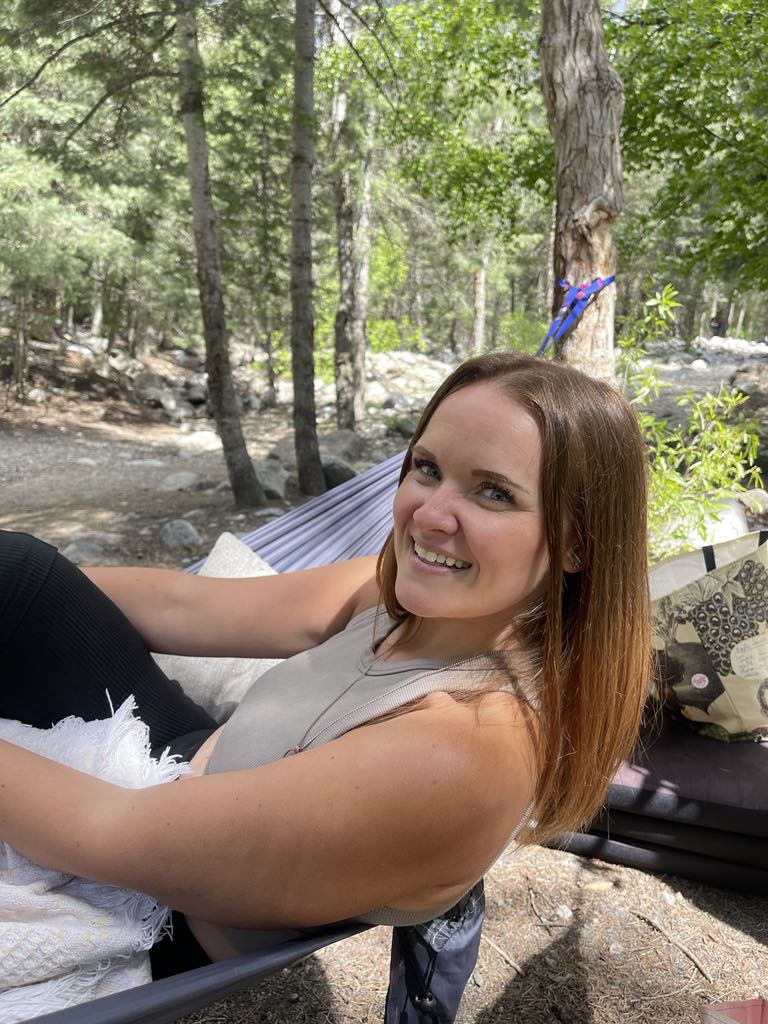 Ember relaxing outdoors, smiling