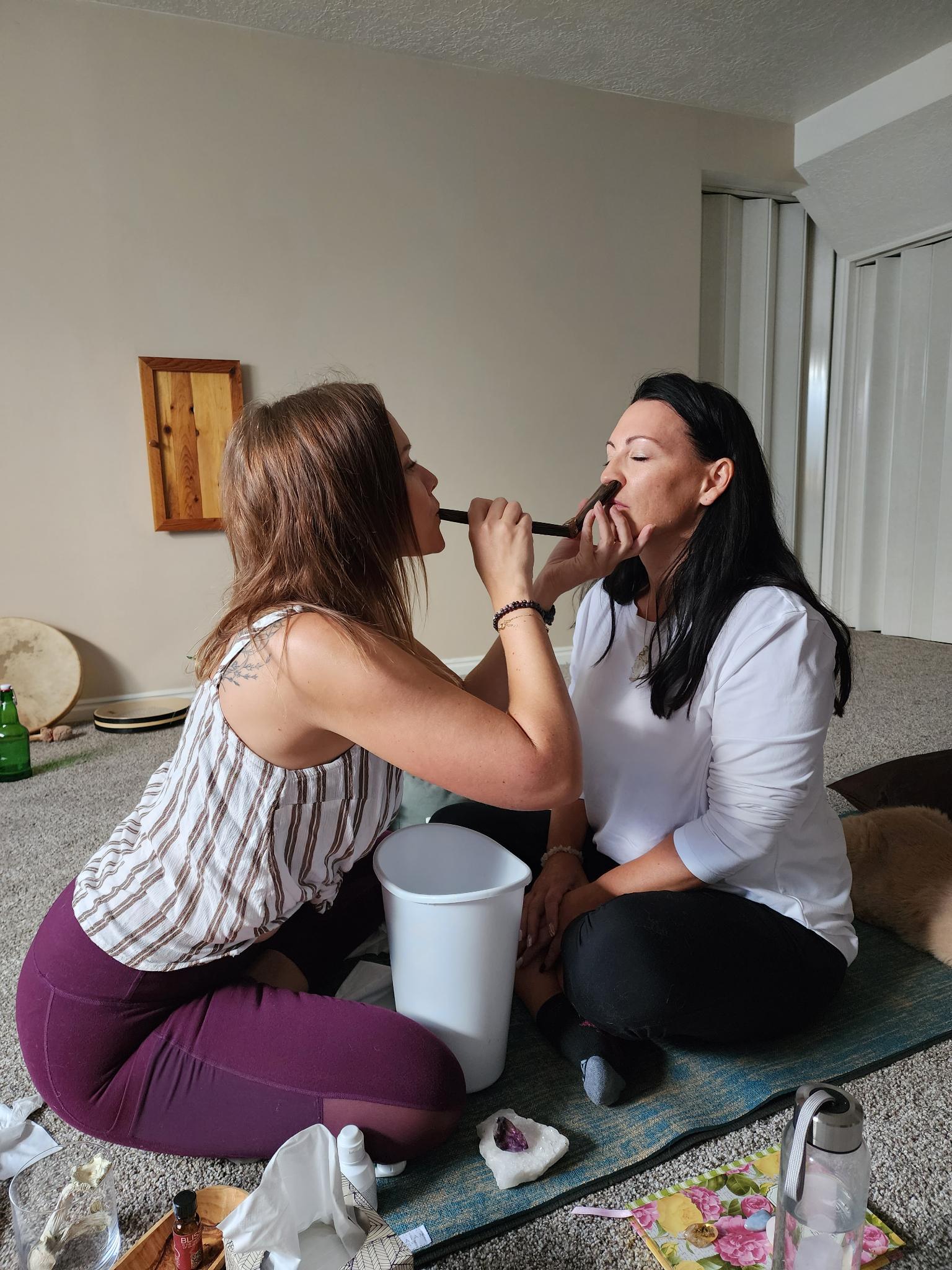 Ember sharing a plant medicine ceremony with a client