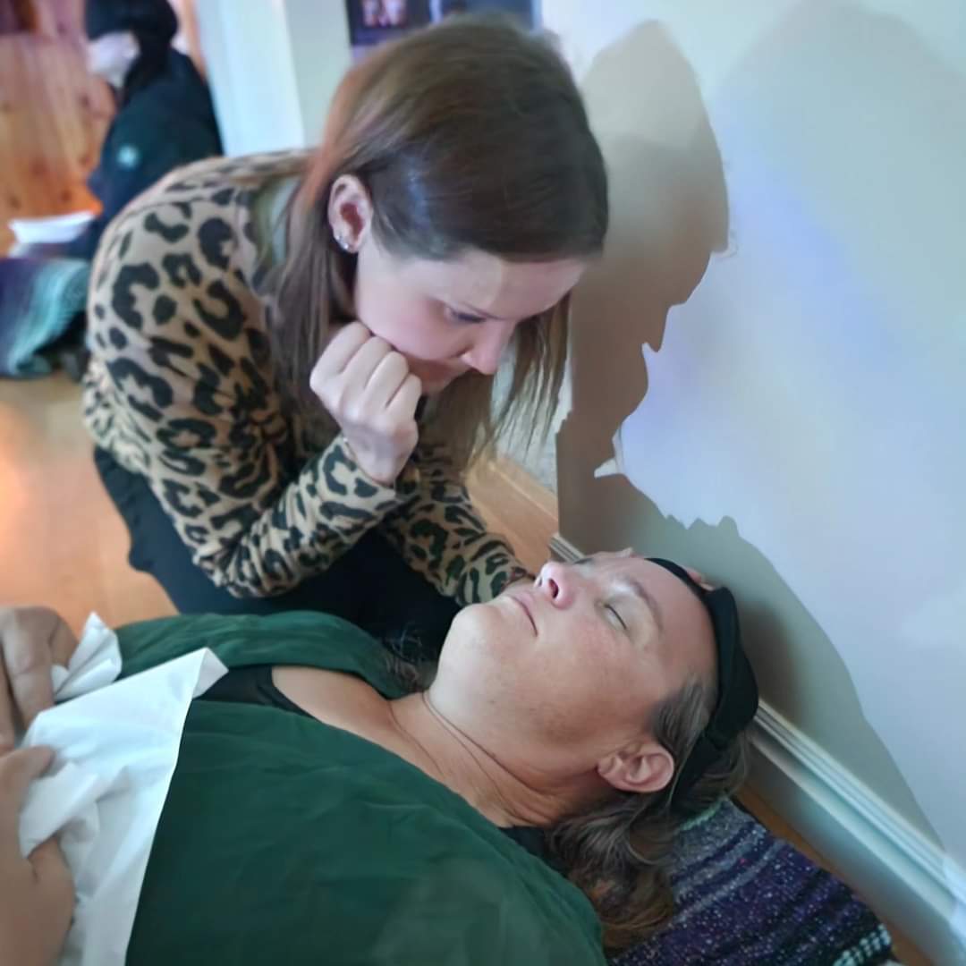 Ember guiding a client through an energy healing session